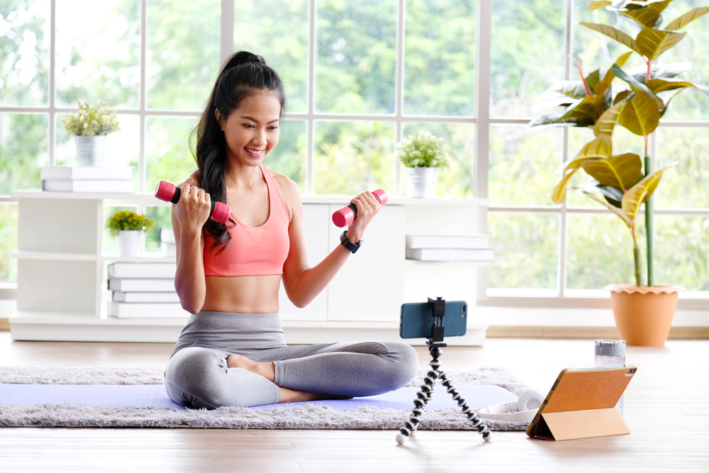 lady is taking online strength training class